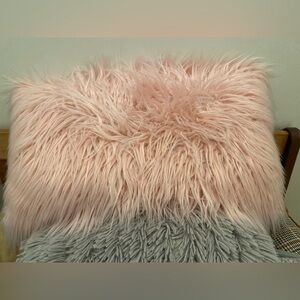 Pink rectangular fuzzy decorative pillow